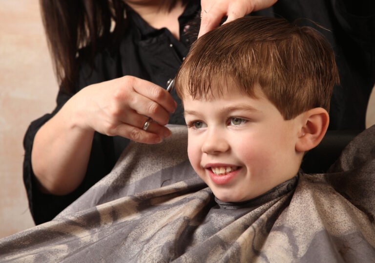 Young boy receiving a haircut